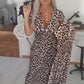 V-ringad klänning med leopardmönster för kvinnor